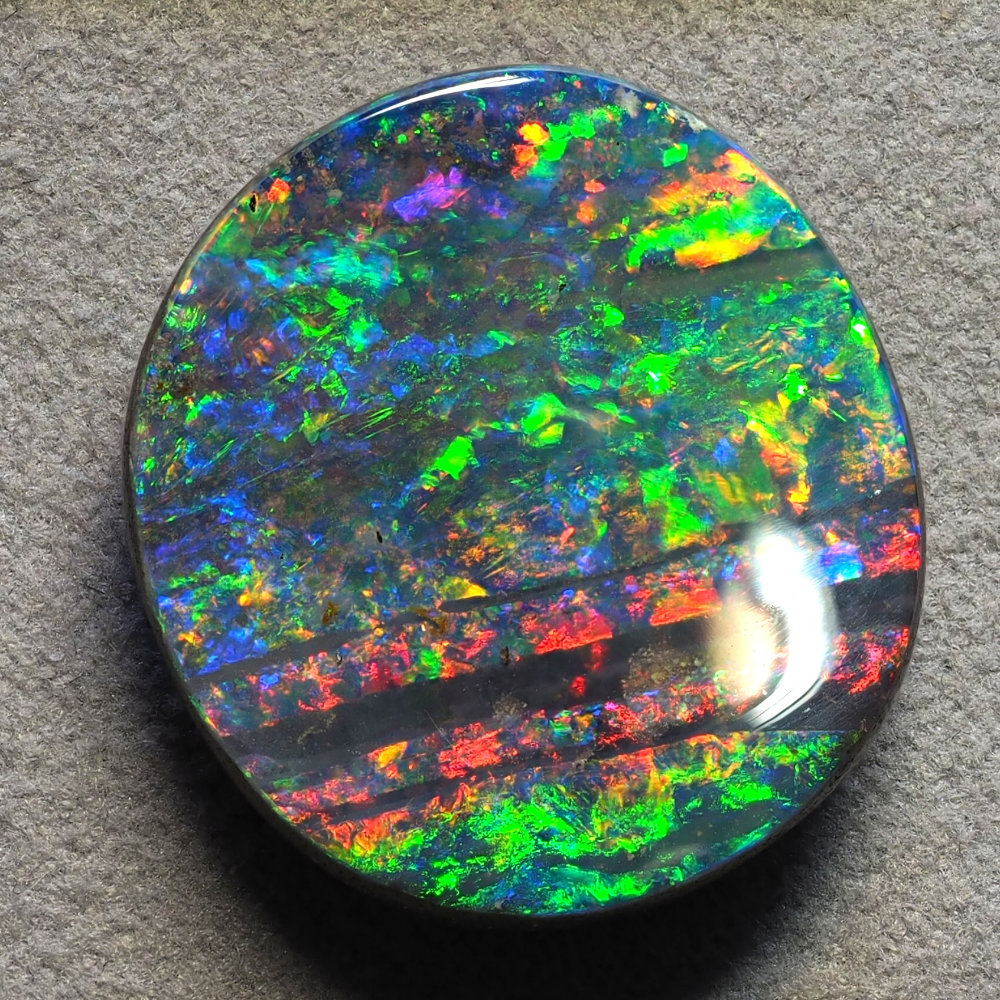 Natural Australian opal from the Christianos Opals collection, showing play-of-colour