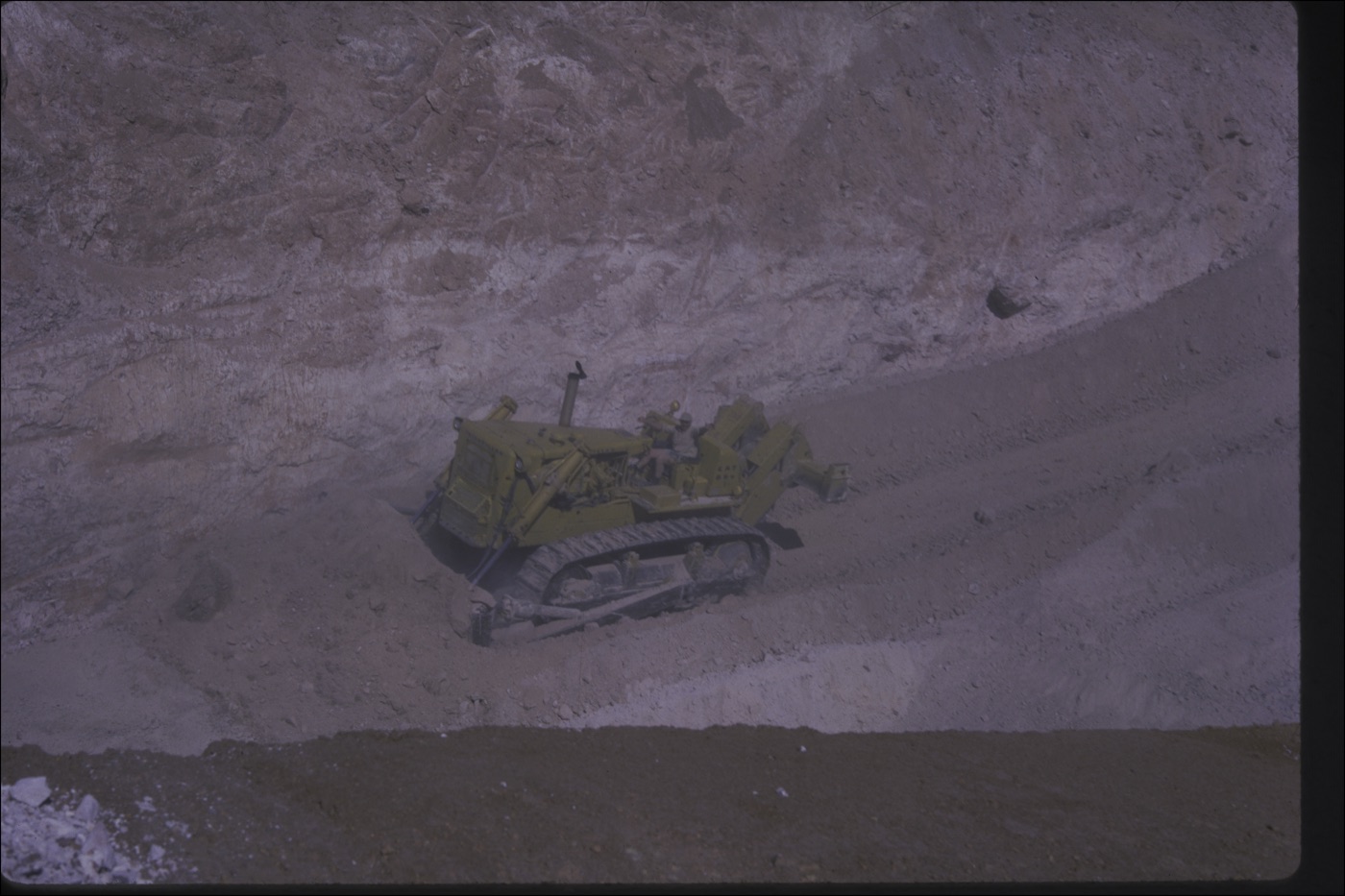 Close view of the bulldozer cutting the opal level at the Ten Mile field